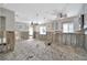 Spacious kitchen awaiting renovation featuring large windows and contemporary ceiling fans at 4151 Belle Vista Dr, St Pete Beach, FL 33706
