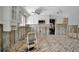 View of kitchen shows renovations needed with missing drywall, flooring, and exposed pipes and wiring at 4151 Belle Vista Dr, St Pete Beach, FL 33706