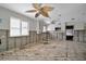 Kitchen with white cabinets, exposed frame and original wood floors at 4151 Belle Vista Dr, St Pete Beach, FL 33706
