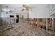 Kitchen featuring exposed walls, original wood floors, and ladder at 4151 Belle Vista Dr, St Pete Beach, FL 33706