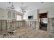 View of kitchen shows renovations needed with missing drywall, flooring, and exposed pipes and wiring at 4151 Belle Vista Dr, St Pete Beach, FL 33706