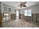 Kitchen area with exposed frame and original wood floors at 4151 Belle Vista Dr, St Pete Beach, FL 33706