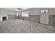 Bright living room awaiting renovation with a fireplace, window, and entry door at 4151 Belle Vista Dr, St Pete Beach, FL 33706