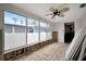 Sunroom featuring tiled floors, exposed framing and large windows overlooking the neighborhood at 4151 Belle Vista Dr, St Pete Beach, FL 33706