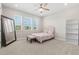 Bright bedroom with large windows, neutral decor, and ample natural light at 4600 Lagona Ln, Wesley Chapel, FL 33543