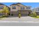 Beautiful two-story home with a two-car garage and a paver driveway and lush landscaping at 4600 Lagona Ln, Wesley Chapel, FL 33543