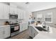 Modern kitchen featuring stainless steel appliances, ample counter space and cozy breakfast nook at 4600 Lagona Ln, Wesley Chapel, FL 33543