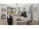 Comfortable living room with a large sectional sofa, wood floors, and ample natural light at 4600 Lagona Ln, Wesley Chapel, FL 33543