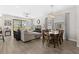 Cozy living space with comfortable seating, a view of the dining area, and lots of natural light at 4600 Lagona Ln, Wesley Chapel, FL 33543