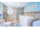 Luxurious bathroom featuring a walk-in shower with glass door and a convenient access bathtub at 4801 Osprey S Dr # 508, St Petersburg, FL 33711