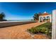 Picturesque gazebo with beach access, outdoor shower, and lush landscaping provides a perfect coastal retreat at 4801 Osprey S Dr # 508, St Petersburg, FL 33711