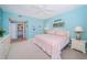 Inviting bedroom with calming colors, neutral carpet, ensuite bathroom, and a comfortable queen-sized bed at 4801 Osprey S Dr # 508, St Petersburg, FL 33711