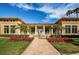 Stunning clubhouse entrance featuring a symmetrical design, lush landscaping, and a welcoming brick walkway at 4801 Osprey S Dr # 508, St Petersburg, FL 33711