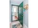 Condo entryway featuring a solid green door and tile flooring at 4801 Osprey S Dr # 508, St Petersburg, FL 33711