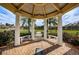 Charming gazebo offering a peaceful retreat with views of the lake and surrounding landscape at 4801 Osprey S Dr # 508, St Petersburg, FL 33711