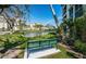 Scenic view of a pond and well-maintained lawns with a bench, complemented by beautiful buildings at 4801 Osprey S Dr # 508, St Petersburg, FL 33711