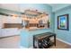 Kitchen features tile floor, granite countertop, stainless appliances and breakfast bar at 4801 Osprey S Dr # 508, St Petersburg, FL 33711