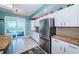 Open kitchen with access to the lanai features stainless appliances and granite countertops at 4801 Osprey S Dr # 508, St Petersburg, FL 33711