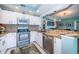 This kitchen features stainless appliances, granite countertops, tile backsplash and is open to the living area at 4801 Osprey S Dr # 508, St Petersburg, FL 33711