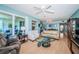 Spacious living room with comfortable seating, hardwood floors and balcony access at 4801 Osprey S Dr # 508, St Petersburg, FL 33711