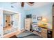 Cozy office space featuring a built-in desk and storage, adjacent to a bathroom and laundry area at 4801 Osprey S Dr # 508, St Petersburg, FL 33711