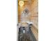 Small, rustic-style bathroom featuring a unique sink, mirror, and a toilet, exuding charm at 5010 45Th N Ave, St Petersburg, FL 33709