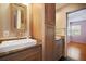This bathroom features modern cabinetry, granite countertops, and a vessel sink with a stylish faucet at 5010 45Th N Ave, St Petersburg, FL 33709