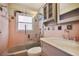 Classic bathroom featuring a shower-tub combo and vanity sink with patterned tile and pink walls at 5010 45Th N Ave, St Petersburg, FL 33709