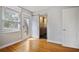 This bedroom features wood floors, access to a full bathroom, natural light, and modern finishes at 5010 45Th N Ave, St Petersburg, FL 33709