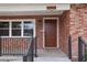 Inviting front entrance with brickwork, complemented by a wooden door and stylish hardware at 5010 45Th N Ave, St Petersburg, FL 33709