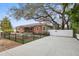 Beautiful single-story brick home featuring an expansive driveway and fenced yard at 5010 45Th N Ave, St Petersburg, FL 33709