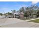 Well-maintained home featuring a carport and gated driveway at 5010 45Th N Ave, St Petersburg, FL 33709