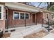 A welcoming brick porch with railings offers a cozy entrance to the home at 5010 45Th N Ave, St Petersburg, FL 33709