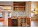 This kitchen features wood cabinets, under counter storage and pull out shelving at 5010 45Th N Ave, St Petersburg, FL 33709