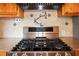 This kitchen features a stainless steel gas range cooktop, designer backsplash and pot filler faucet at 5010 45Th N Ave, St Petersburg, FL 33709