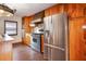 Kitchen featuring stainless steel appliances, wood cabinetry, wood floors, and custom details at 5010 45Th N Ave, St Petersburg, FL 33709