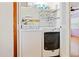 A neatly organized laundry closet featuring a washer, dryer, and shelving for storage at 5010 45Th N Ave, St Petersburg, FL 33709