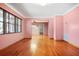 Open-concept living area with hardwood floors, neutral walls and lots of natural light at 5010 45Th N Ave, St Petersburg, FL 33709