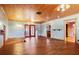 Expansive living room featuring hardwood floors, custom ceiling, and an open floor plan with several entrances at 5010 45Th N Ave, St Petersburg, FL 33709