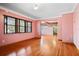 Cozy living room with hardwood floors, large windows, and an open layout at 5010 45Th N Ave, St Petersburg, FL 33709