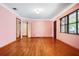 Bright living room featuring hardwood floors, neutral walls and natural light at 5010 45Th N Ave, St Petersburg, FL 33709