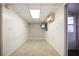 Well-lit room with tiled flooring, white paneled walls, and a ceiling with recessed lighting at 5010 45Th N Ave, St Petersburg, FL 33709
