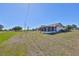 Expansive backyard with well-maintained landscaping and an inviting screened patio at 607 Fox Hills Dr, Sun City Center, FL 33573