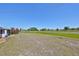 Large open backyard, well maintained, with lovely plants and trees at 607 Fox Hills Dr, Sun City Center, FL 33573