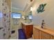 Bathroom with double vanity and wood cabinets with plenty of room for storage at 607 Fox Hills Dr, Sun City Center, FL 33573