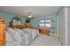 Charming bedroom with vintage-style dresser and window, and a decorative bedspread at 607 Fox Hills Dr, Sun City Center, FL 33573