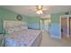 Cozy bedroom featuring neutral walls and a comfortable bed with coastal-themed bedding at 607 Fox Hills Dr, Sun City Center, FL 33573