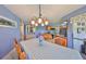 View of dining room with connection to the kitchen, featuring tile floors and modern decor at 607 Fox Hills Dr, Sun City Center, FL 33573