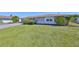 Charming single-story home with a well-maintained lawn and nice landscaping at 607 Fox Hills Dr, Sun City Center, FL 33573