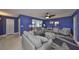 Comfortable living room with modern furniture, stylish rug, and bright blue walls at 607 Fox Hills Dr, Sun City Center, FL 33573